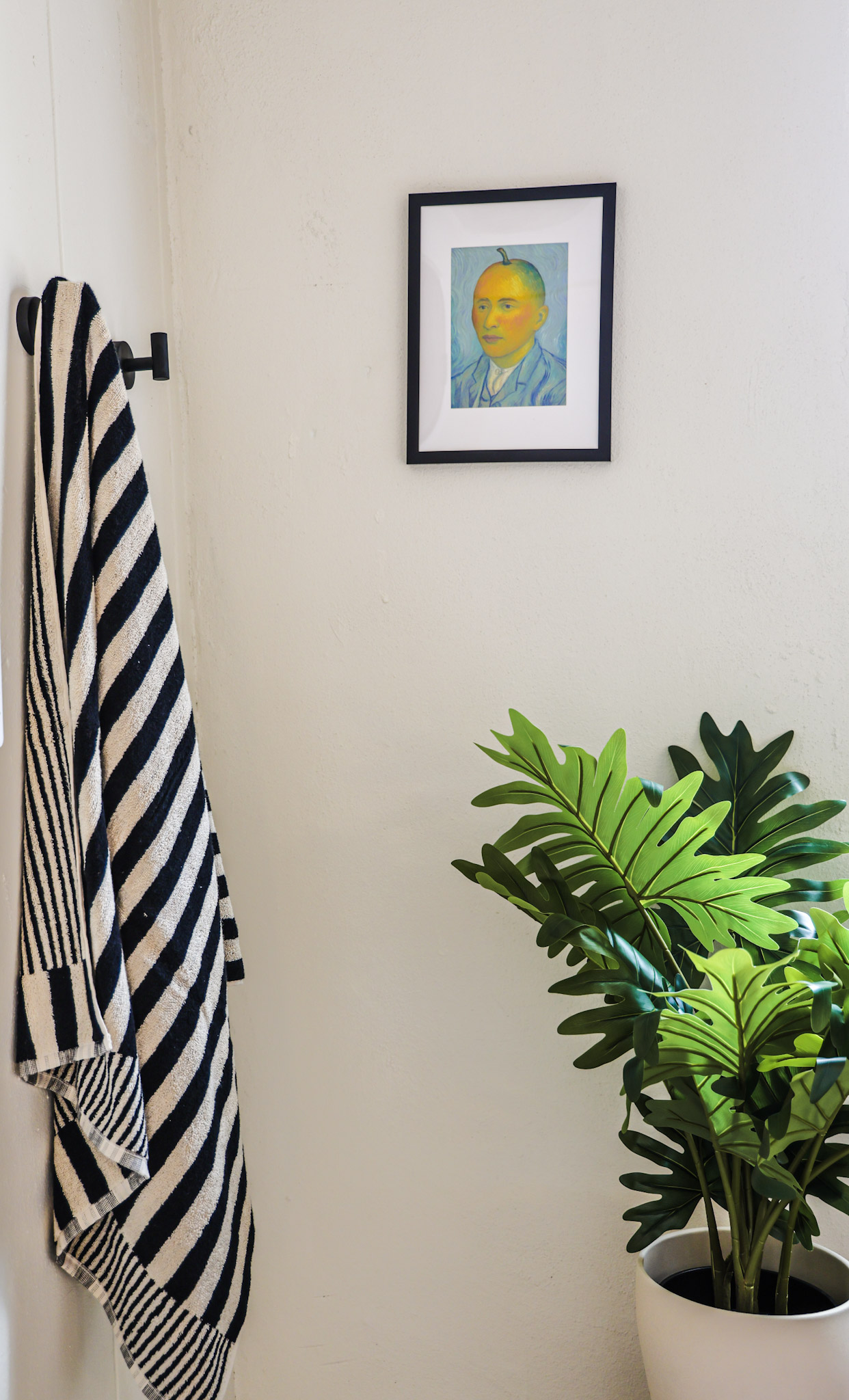 Styled corner with art and towel