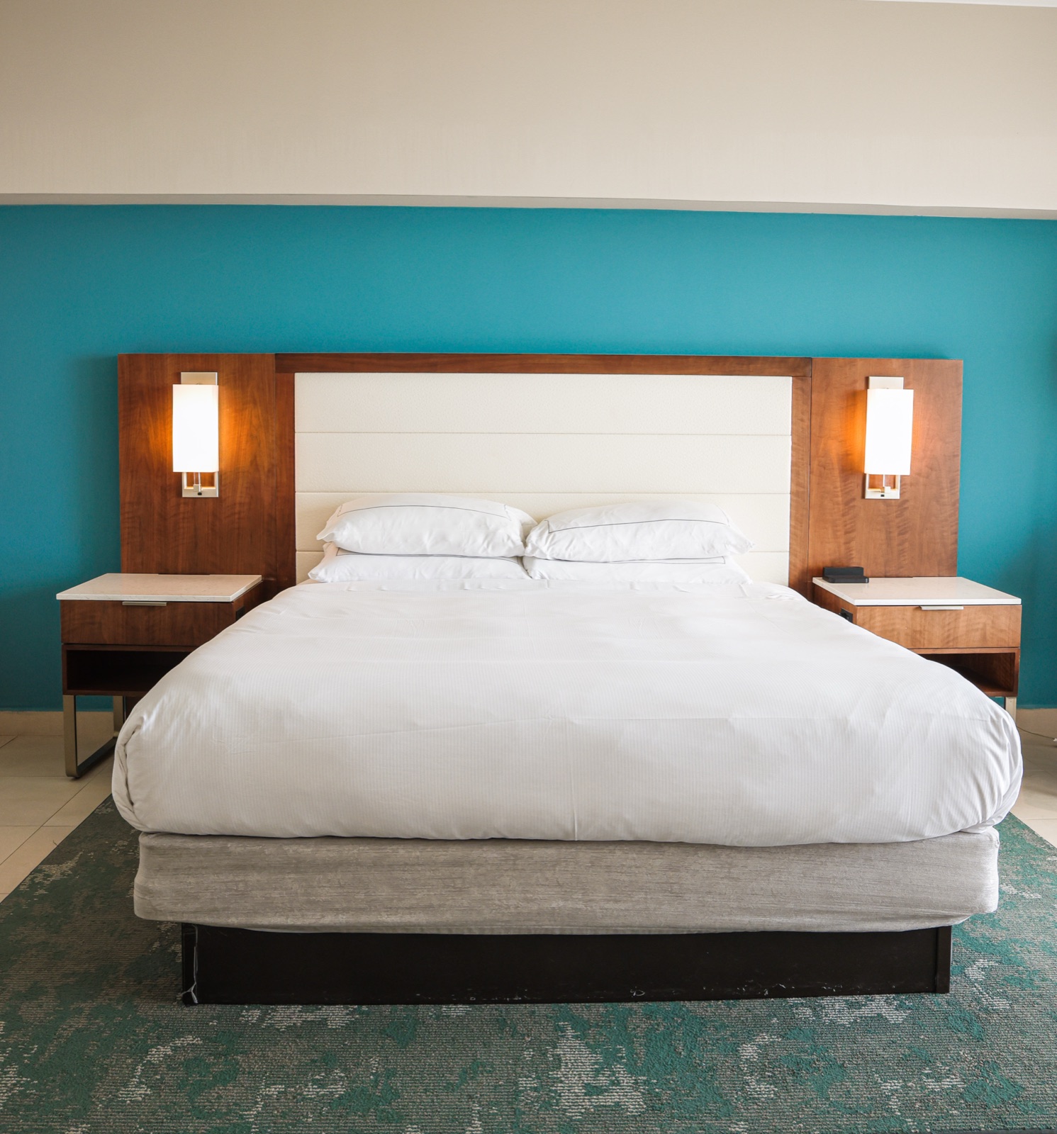 Guest room with teal accent wall