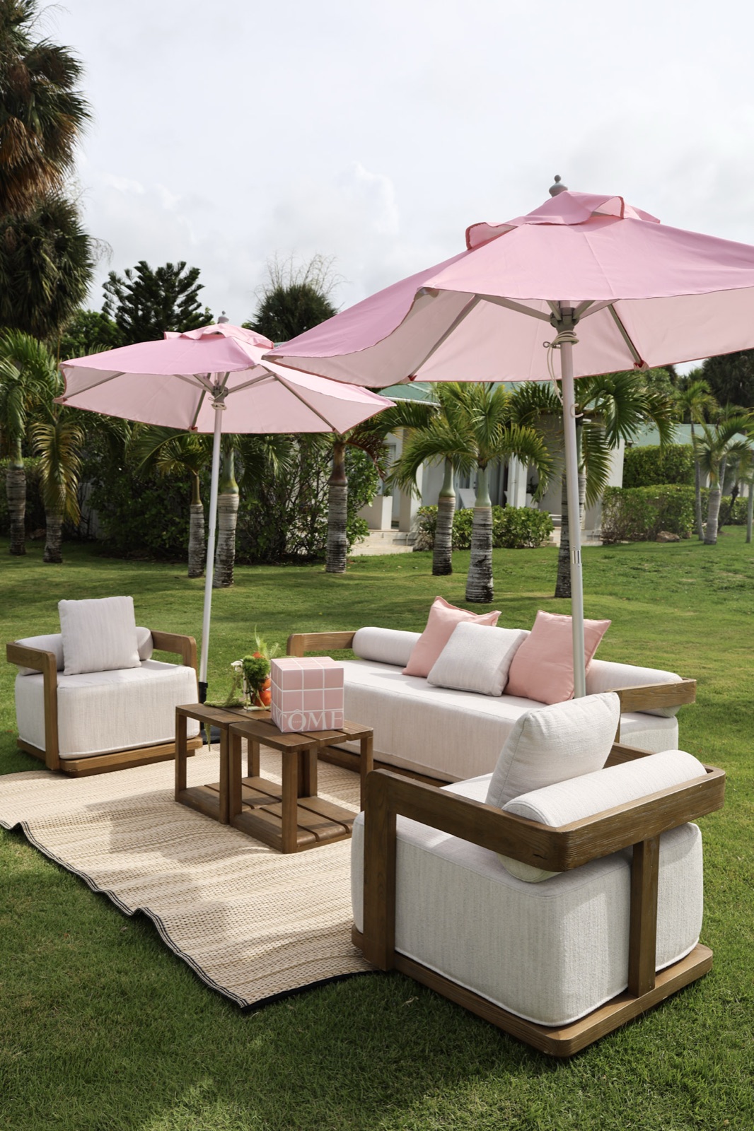 Pink umbrella lounge setup